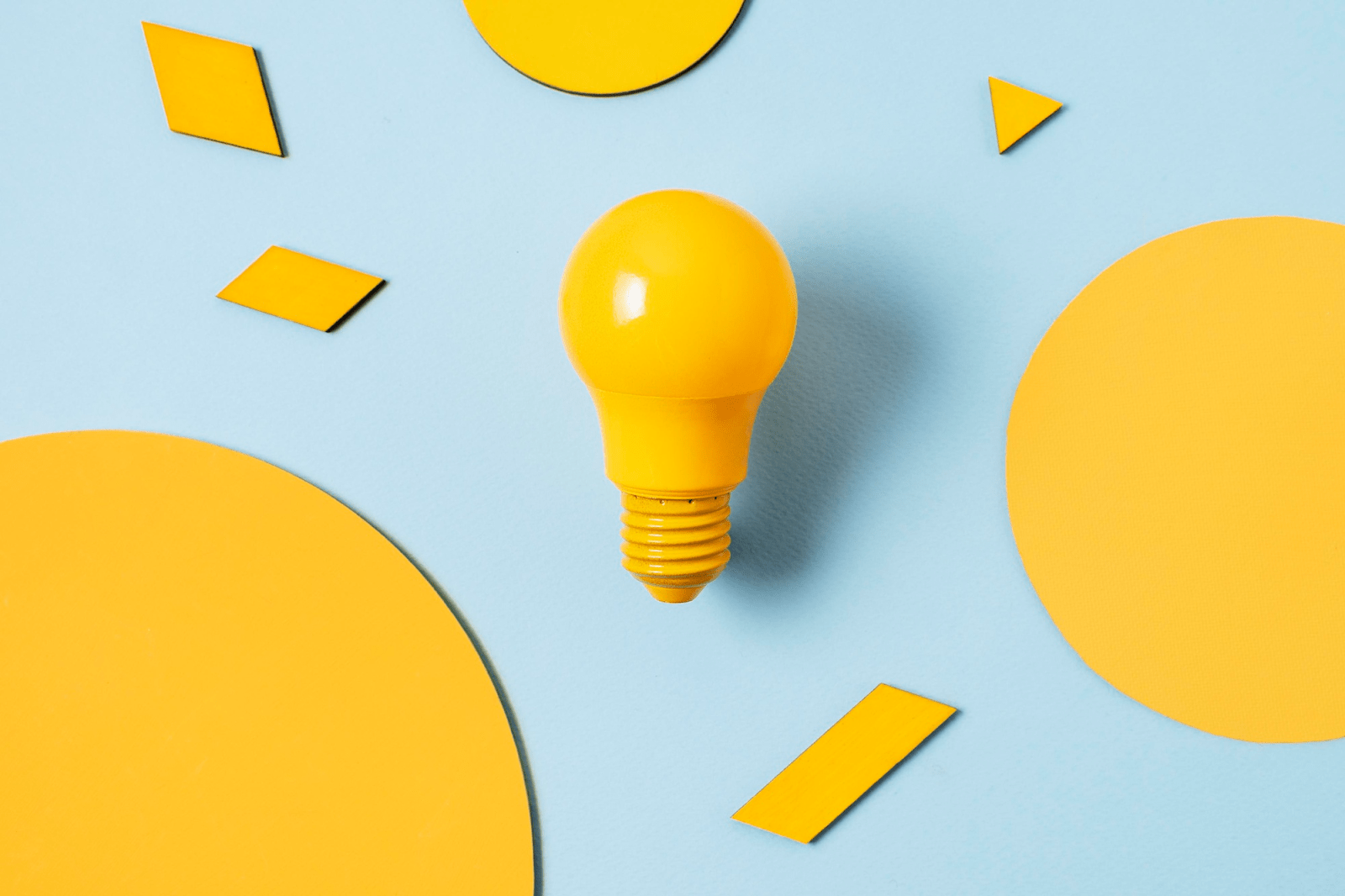 a yellow light bulb shining for insight